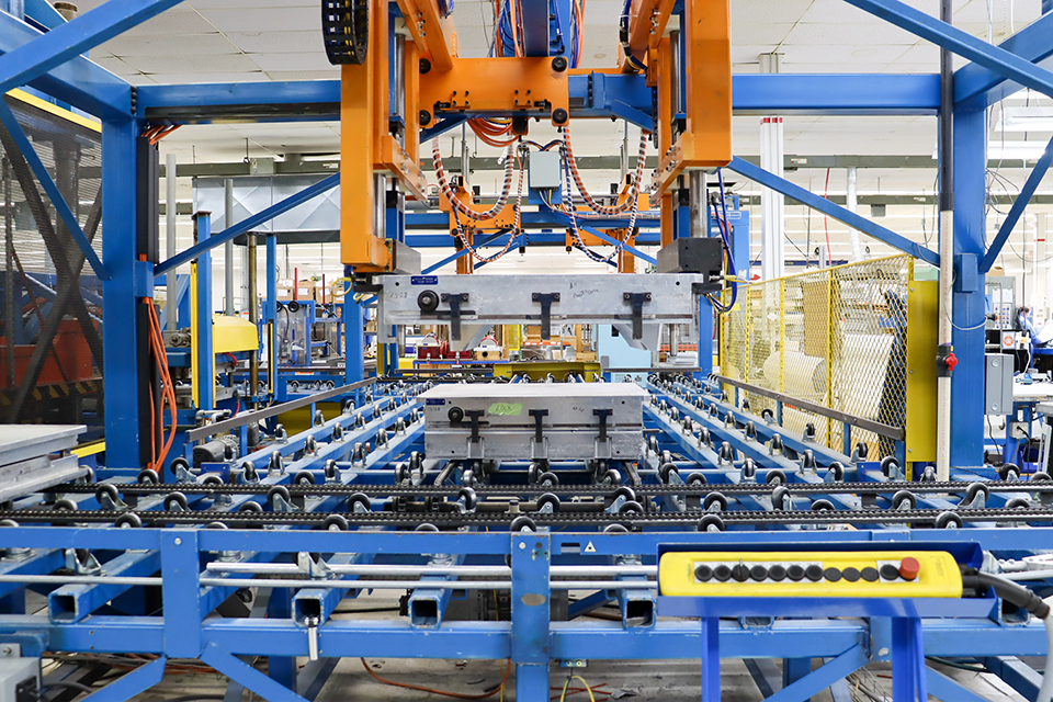 A compression molding press in a production facility.