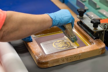 A photo of a screen printing process.