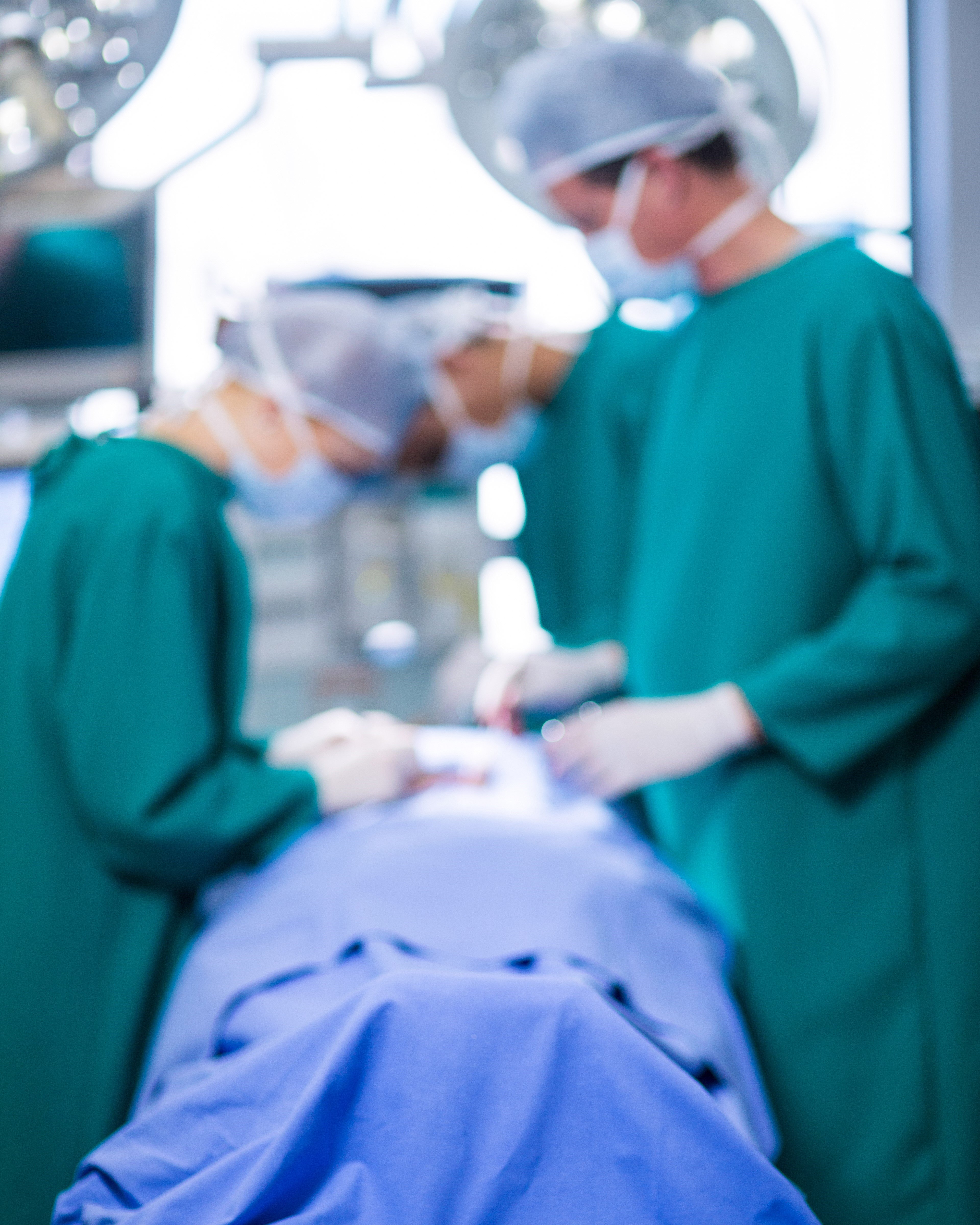 A surgery underway in an image guided therapy operating room 