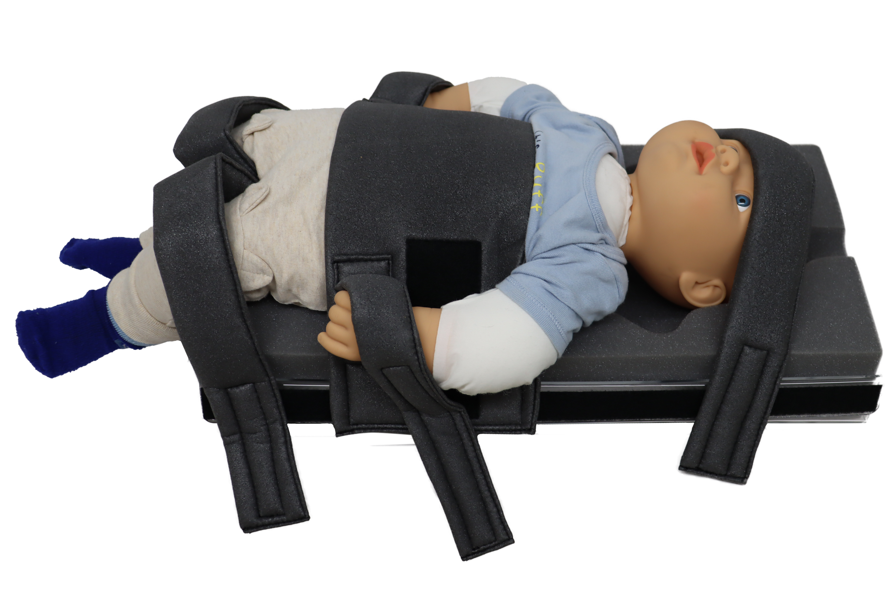 A photo of a baby doll in the Domico Med-Device Pediatric Hugger.