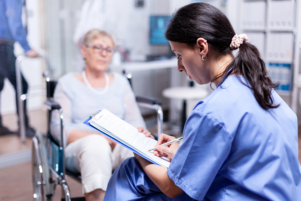 An Administrator working with a patient in the hospital