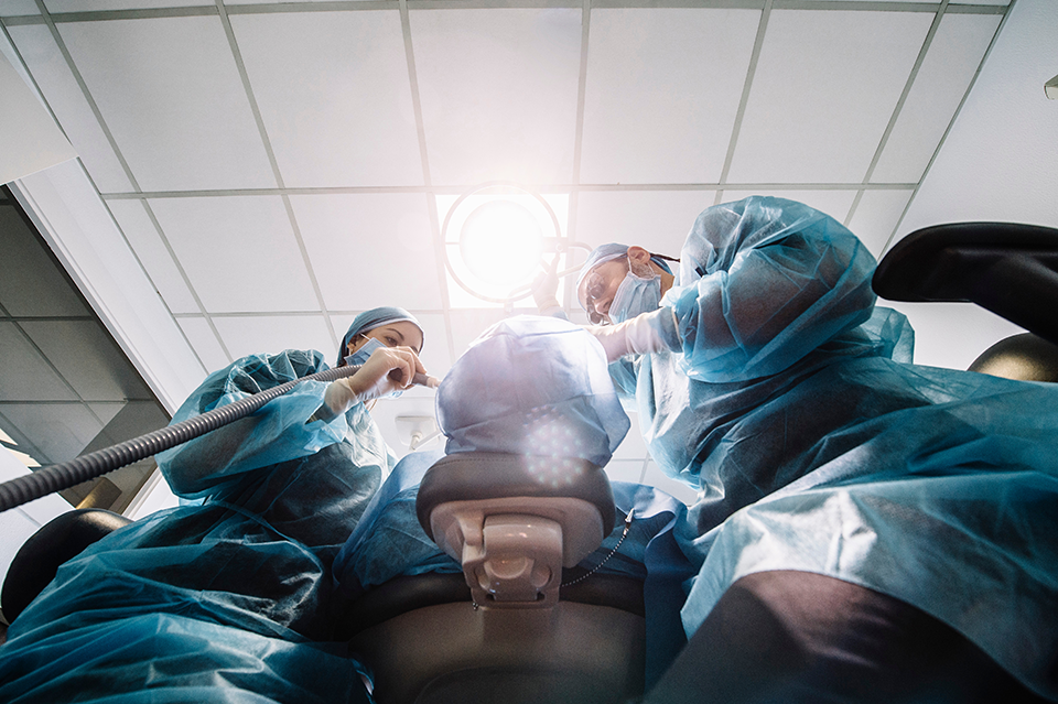 A photo of a surgery being performed taken from under the table.