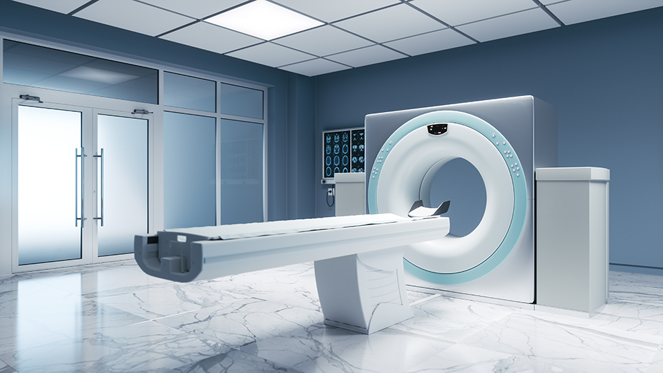 A photo of an empty MRI machine in a diagnostic imaging room.