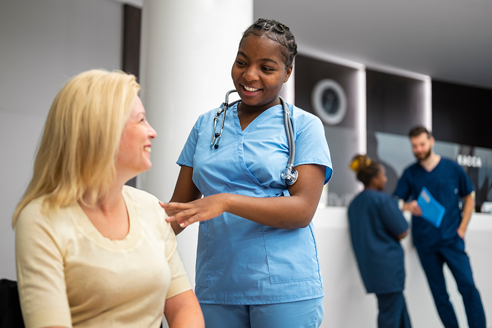 A Caregiver working with a patient in the hospital 