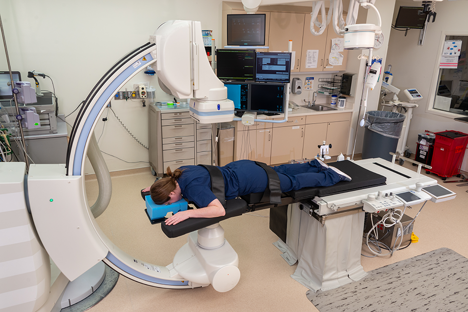 A woman laying down for an x-ray in a philips image guided therapy room