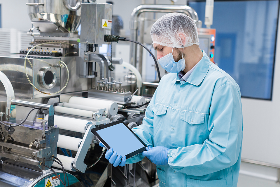 A man conducting Quality Control at Medical Device Manufacturer 