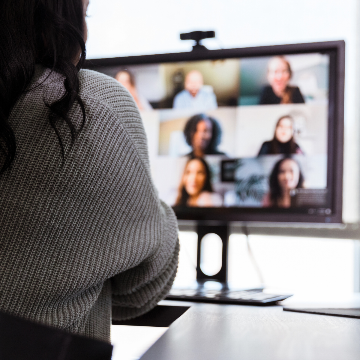 A woman on a zoom meeting in the medical device manufacturing industry